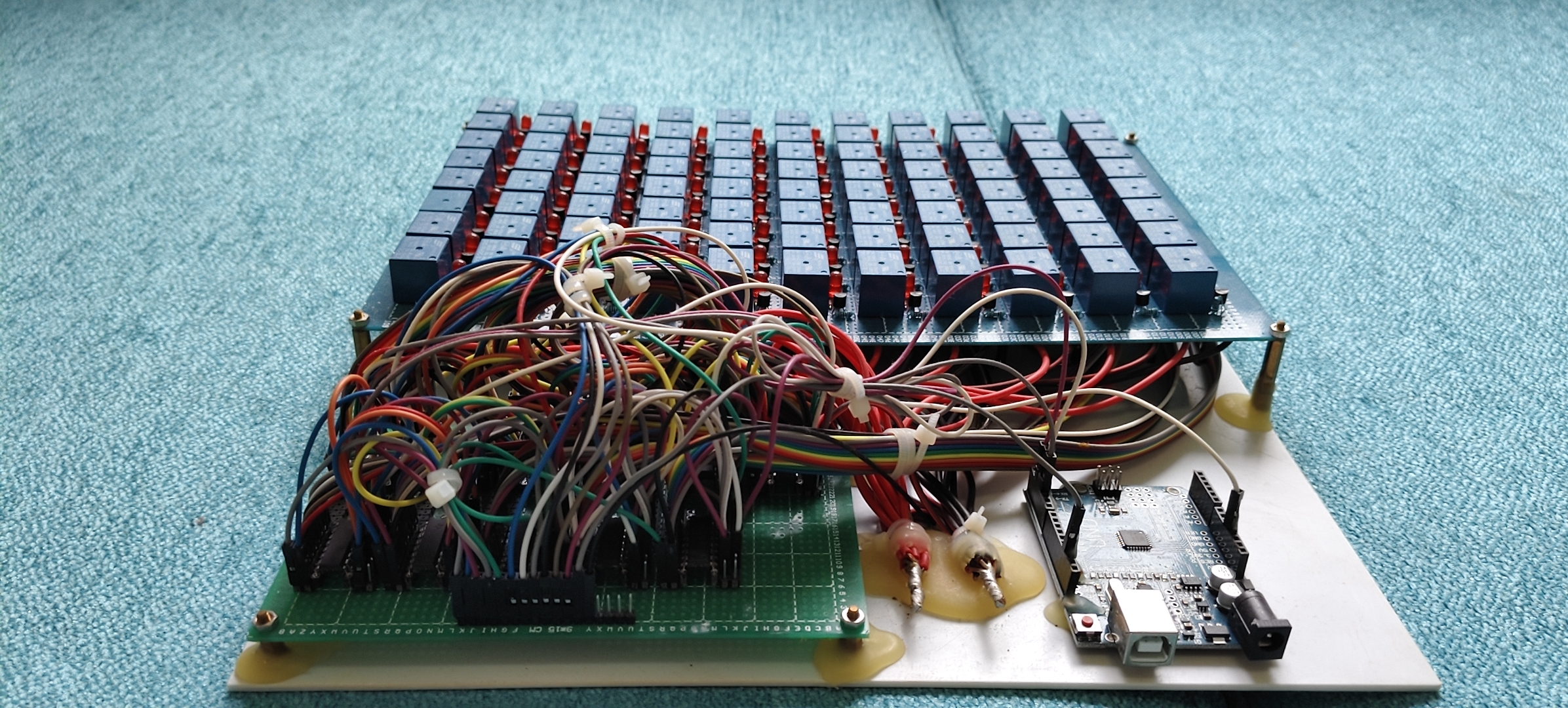 Front view of the relay rows, driver wiring, and Arduino control board